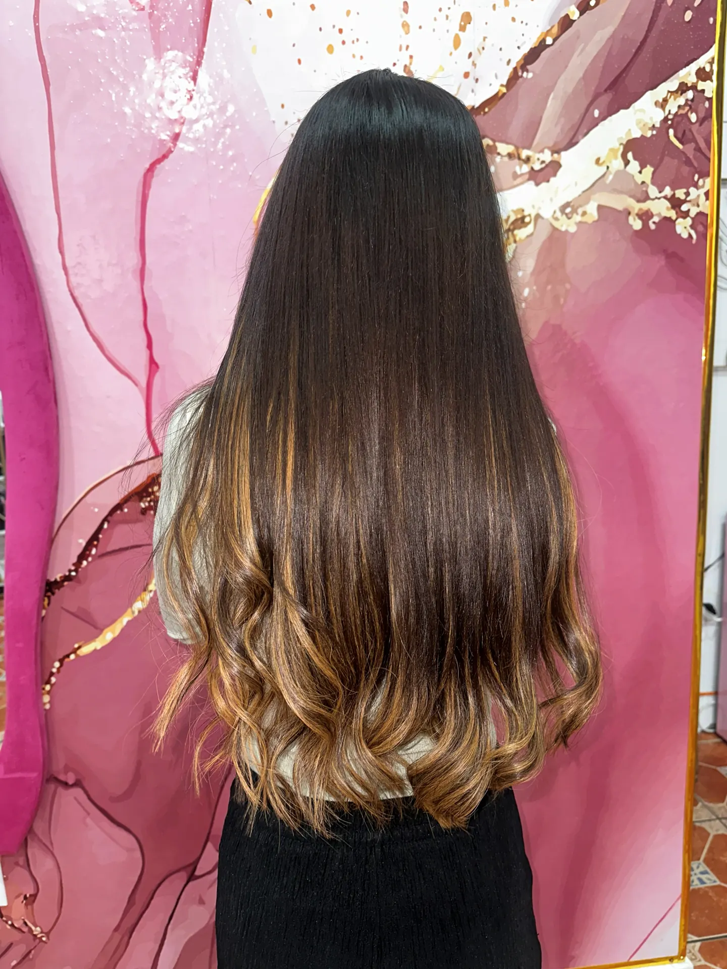 Dark hair with caramel ends after I-tip extensions