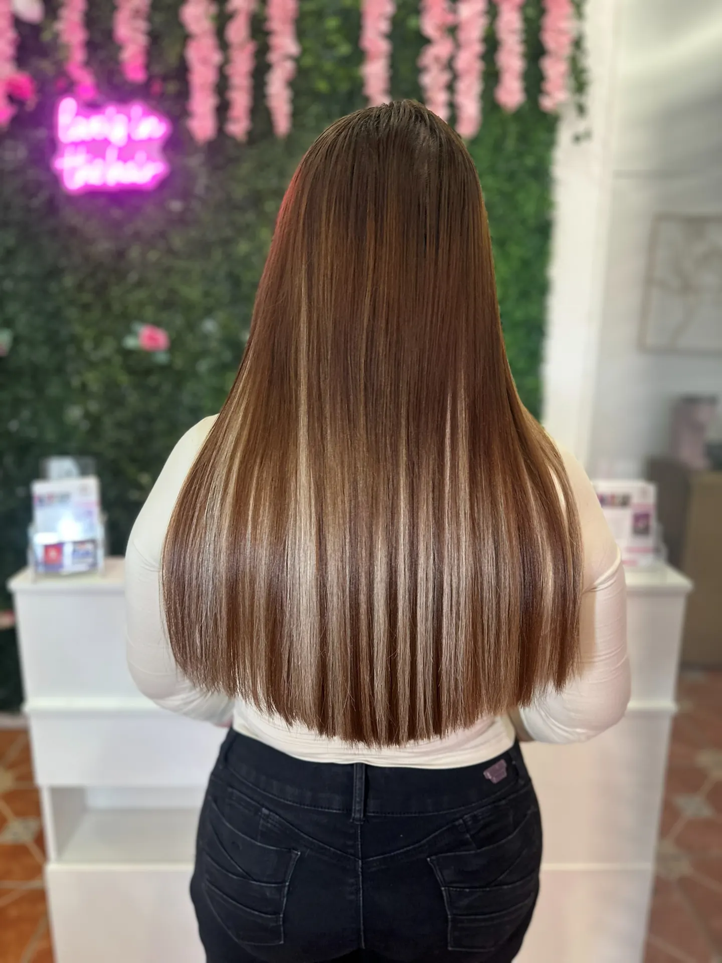 Long straight brunette hair with K-tip extensions