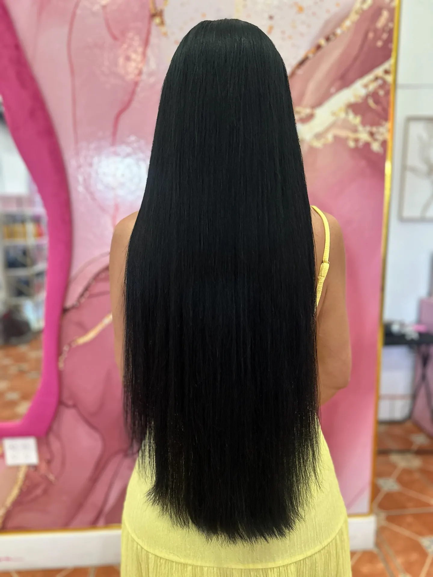 Waist-length black hair after nano-tip extensions