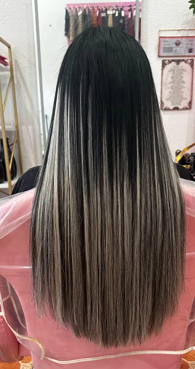 Long black hair with blonde highlights at Concept Beauty Studio